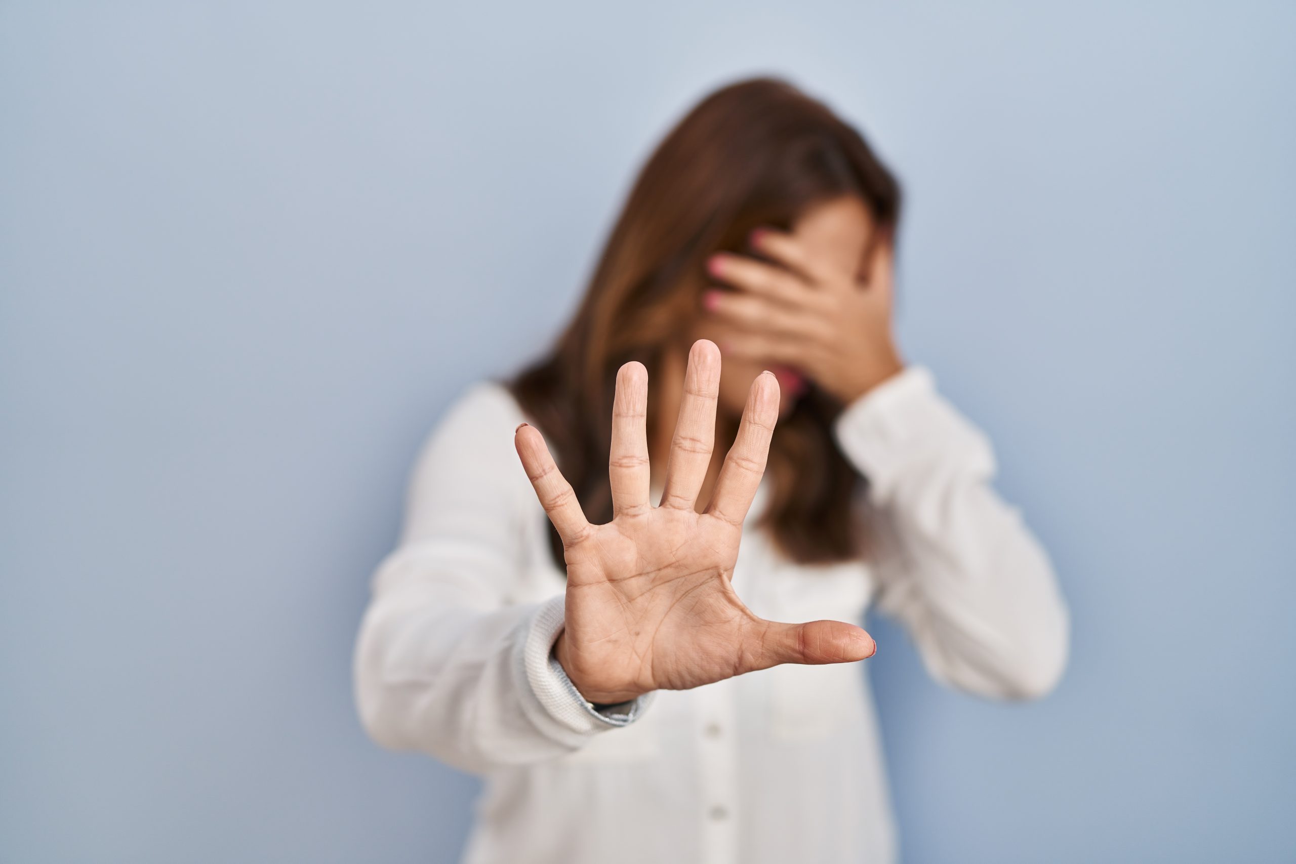 hispanic-woman-standing-over-isolated-background-covering-eyes-with-hands-and-doing-stop-gesture-with-sad-and-fear-expression-embarrassed-and-negative-concept
