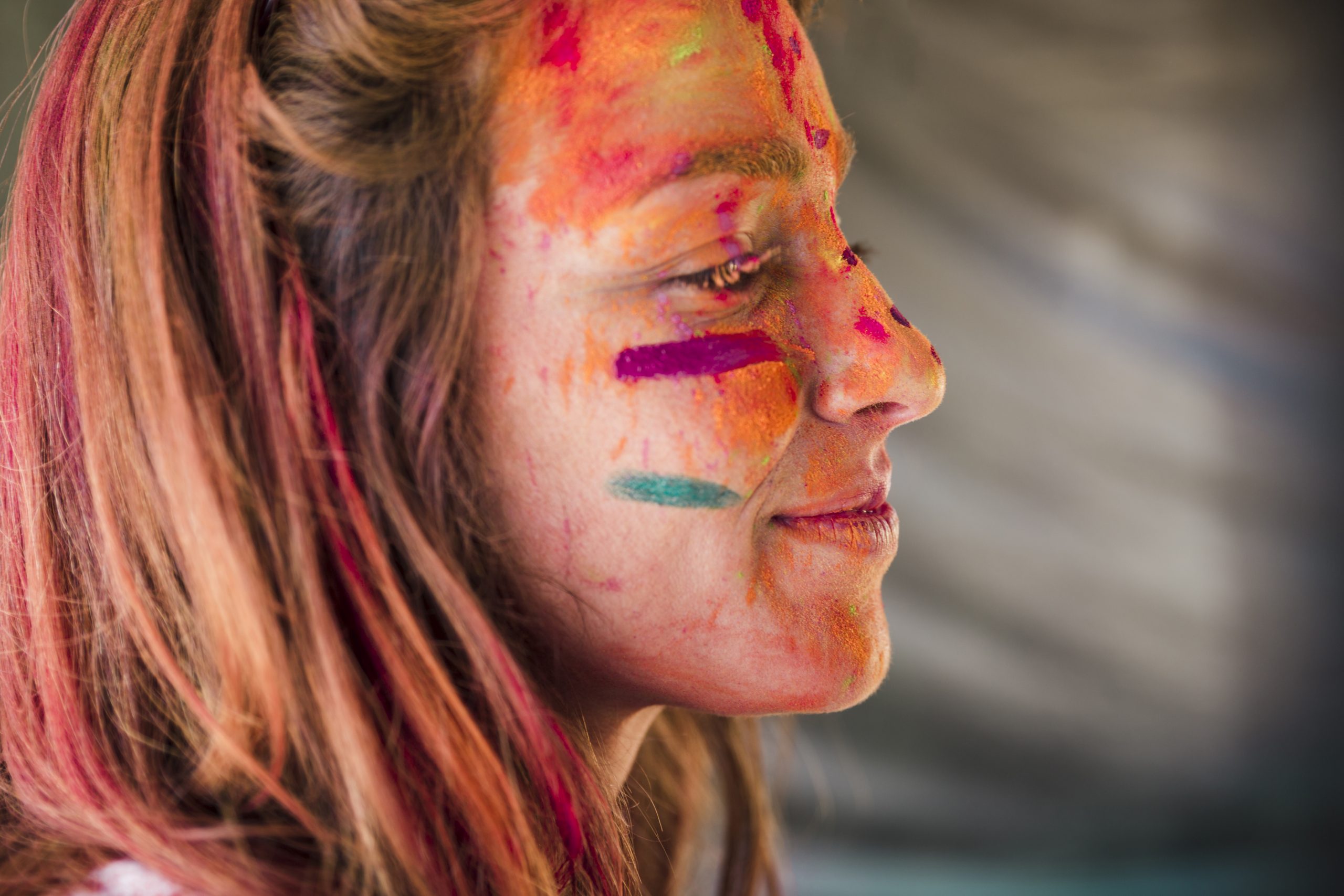 close-up-woman-s-face-covered-with-holi-color
