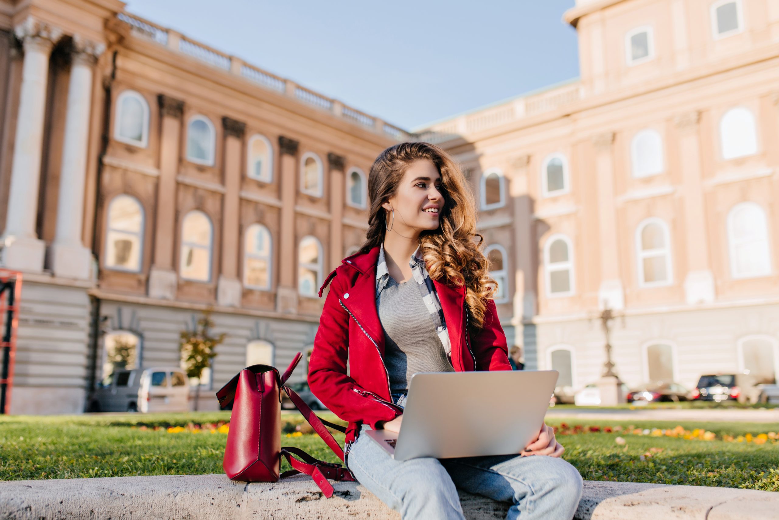 interested-dark-haired-girl-wears-casual-attire-chilling-in-park-near-university-and-using-laptop-outdoor-photo-of-fashionable-female-freelancer-working-with-computer-on-the-grass